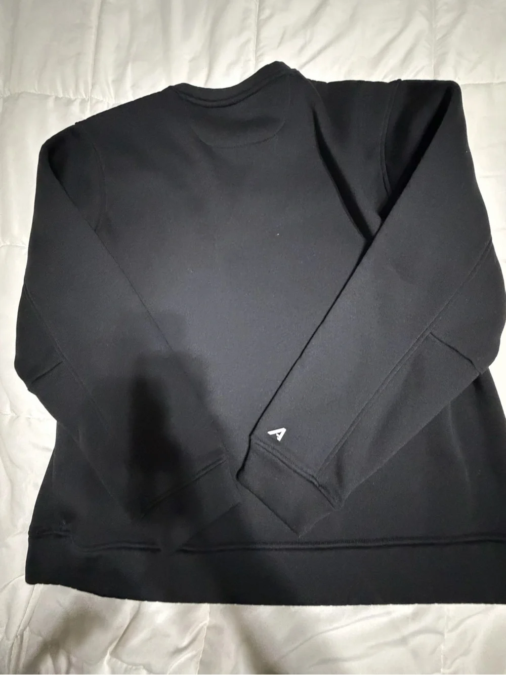 Antigua Black Crewneck Sweatshirt with Small Red Logo
